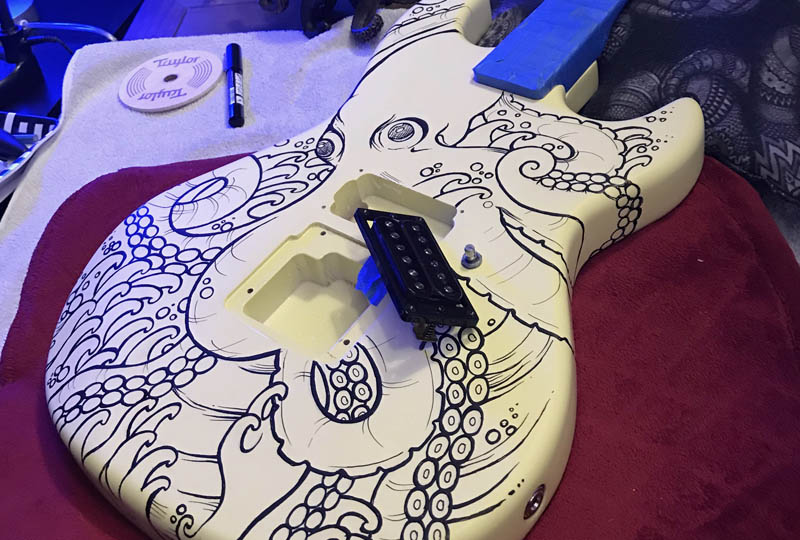 painted guitar with octopus art